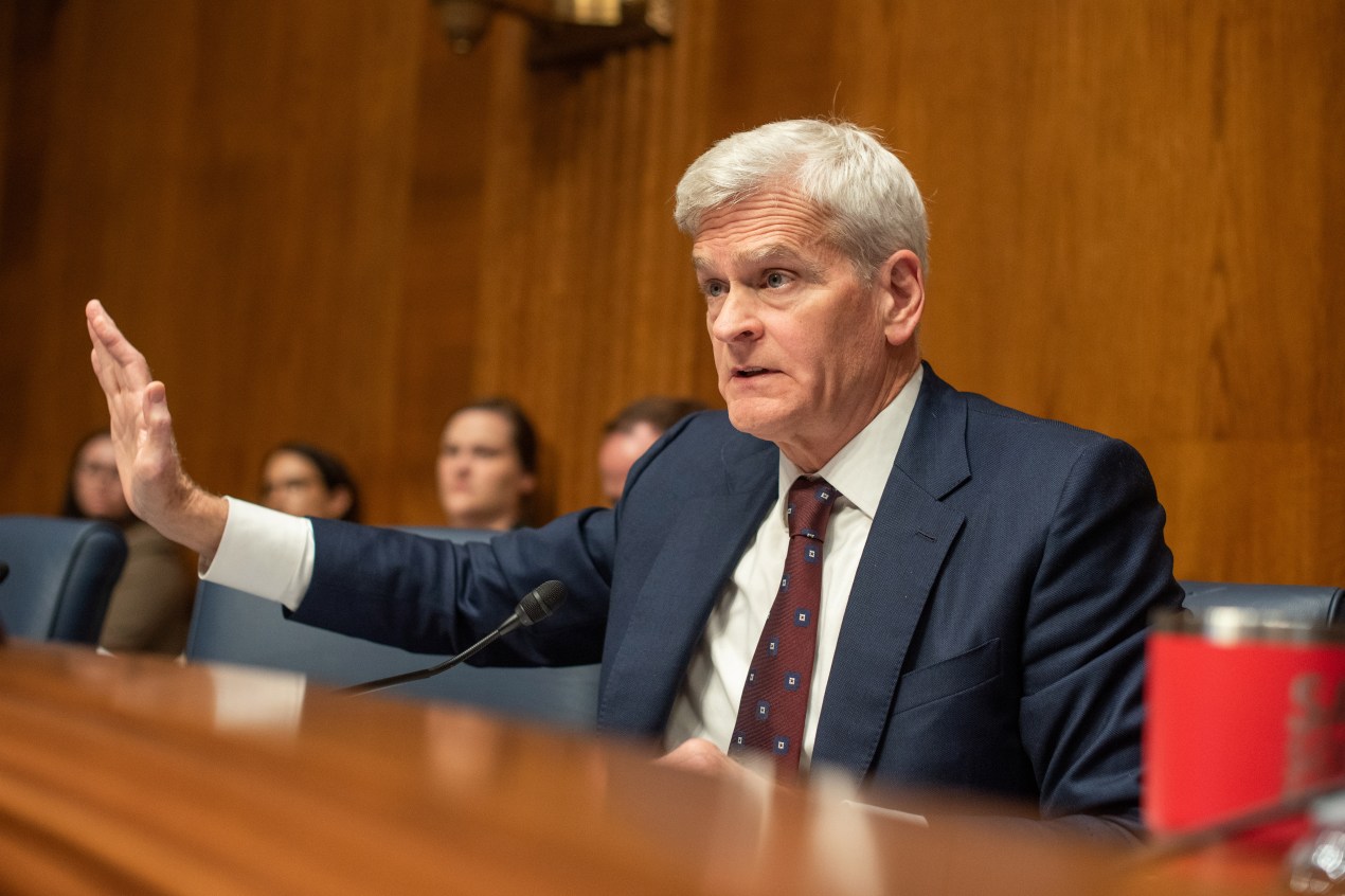 A photo of Senator Bill Cassidy. He is gesturing with his right hand.
