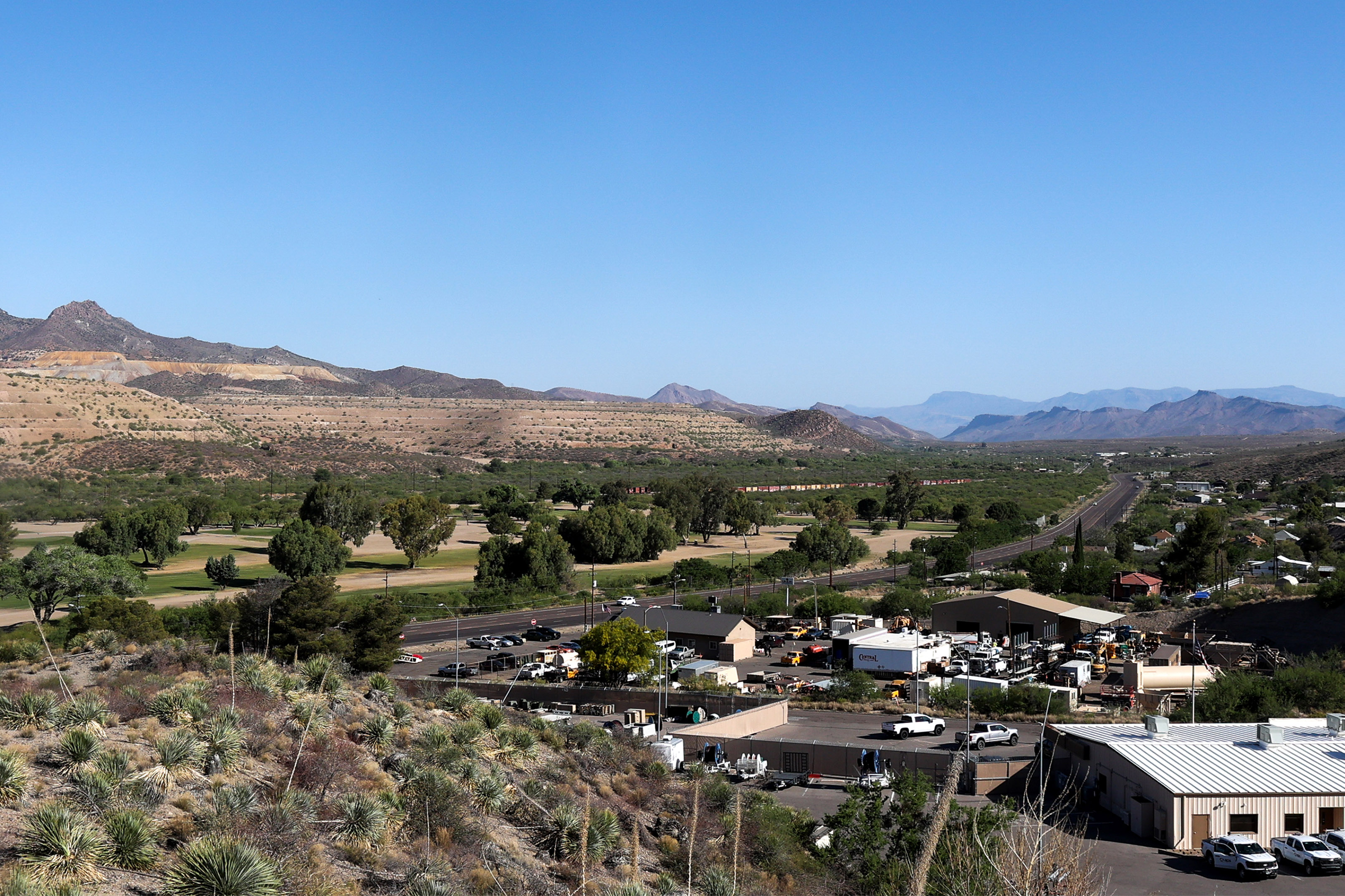 arizona-medicaid-03 A landscape photo shows the town of Globe, Arizona, surrounded by mine tailings: raised rock formations which are a byproduct of the copper mining process.