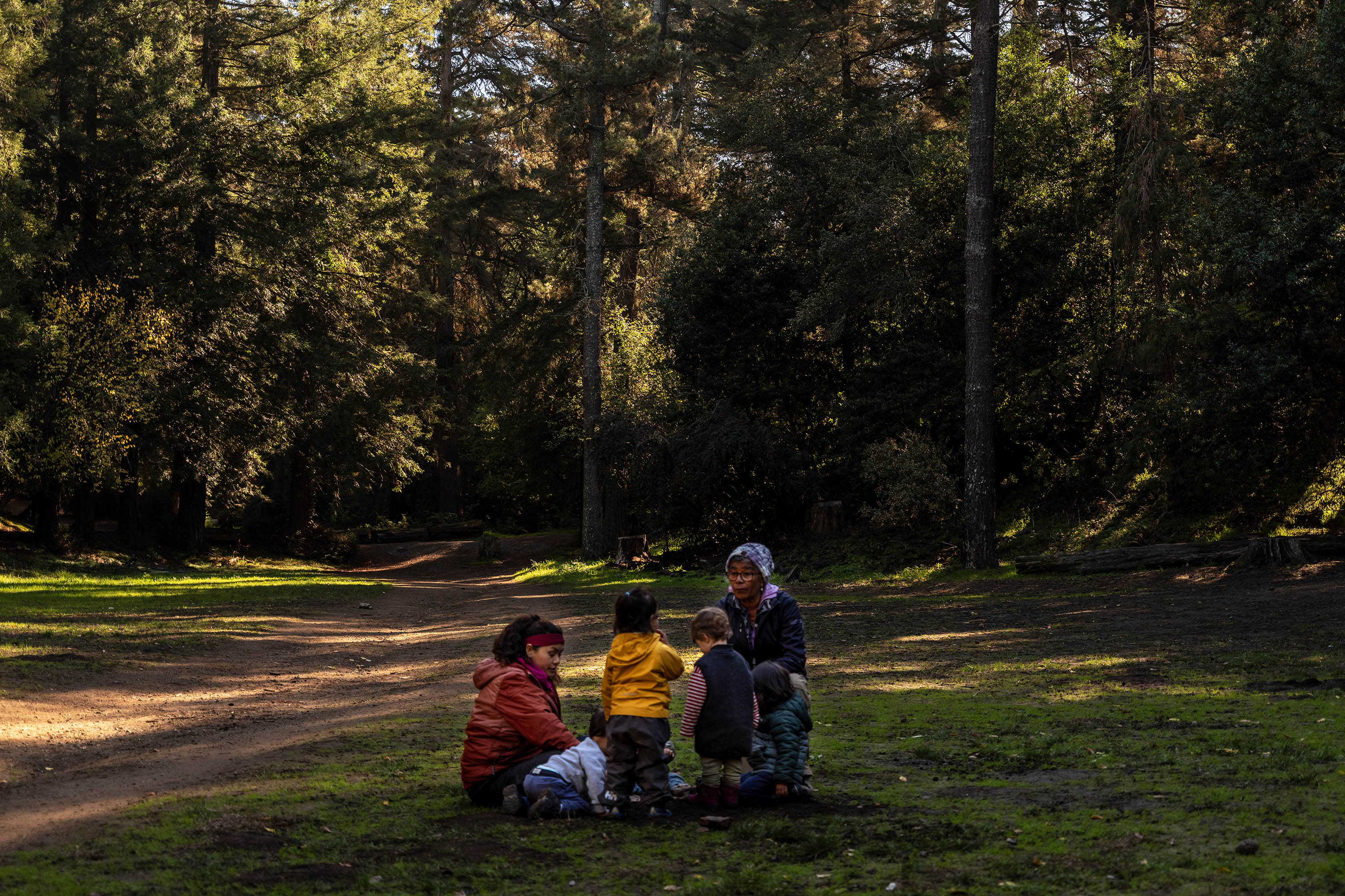 carranza_03 Two adult women gather a small group of toddlers before a walk through a redwood forest nature trail.