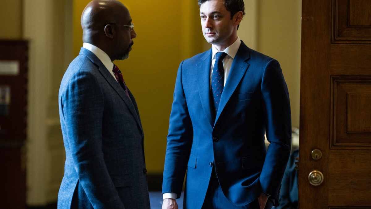 A photo of Sen. Raphael Warnock and Sen. Jon Ossoff at the U.S. Capitol.
