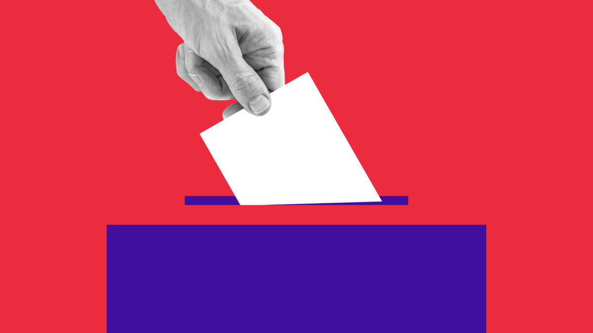 A photo illustration of a hand placing a ballot into a box.
