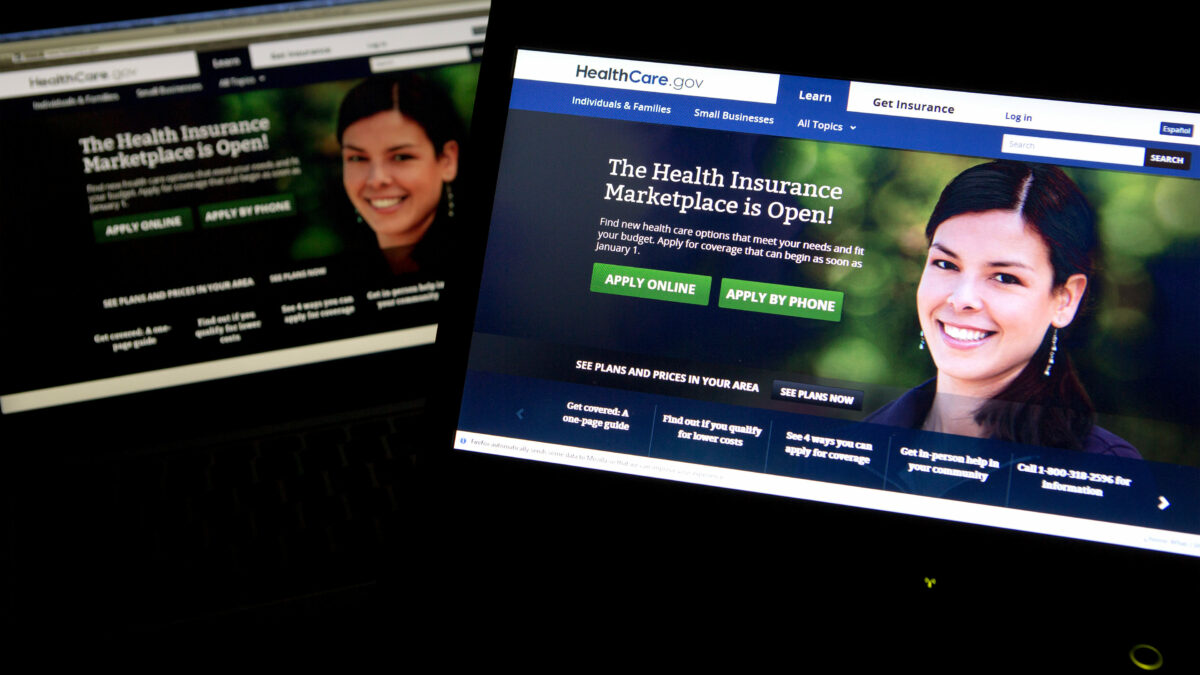 A photo of two laptops with the HealthCare.gov website open.