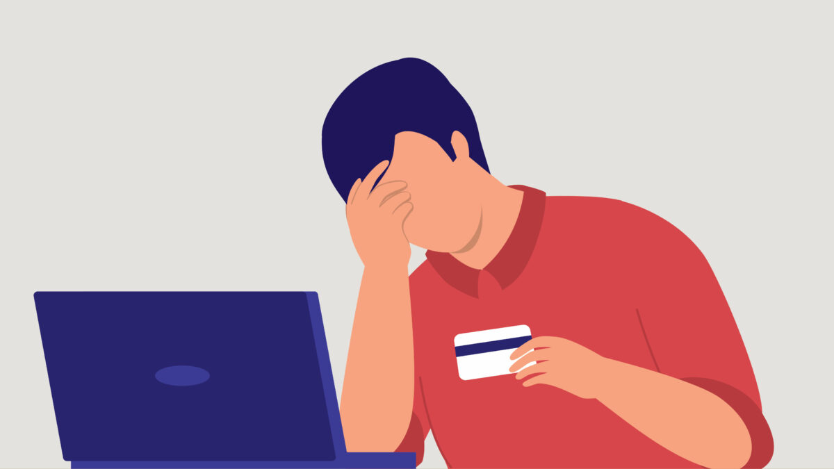 A vector illustration of someone with one hand to their face and a credit card in the other hand. They are sitting in front of a laptop on a table.