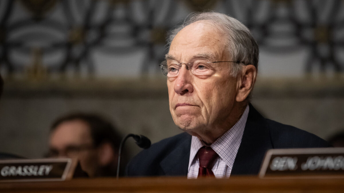 A photograph of Sen. Chuck Grassley, who is seated during a senate hearing.