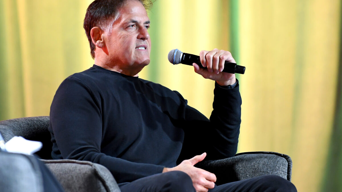A photo of Mark Cuban speaking into a microphone.
