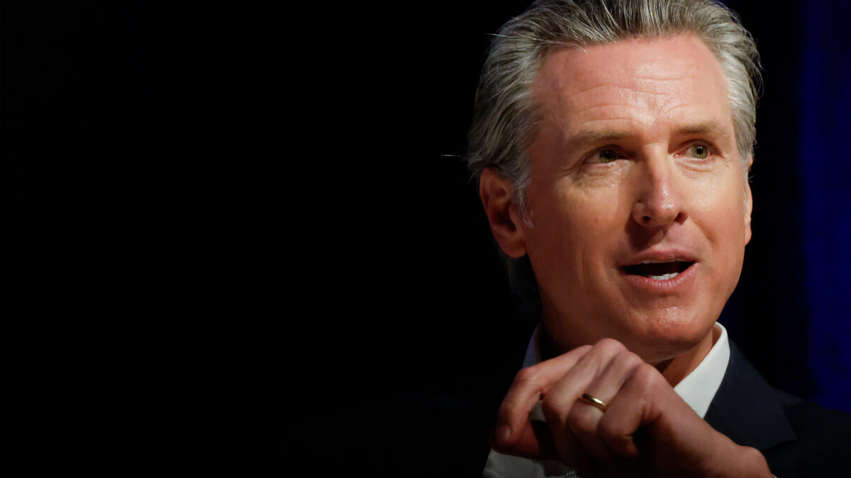 A photo of Gavin Newsom speaking before an audience.