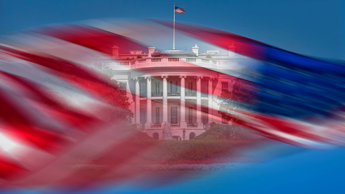 A photo illustration shows the exterior of the White House seen behind a blurred picture of an American flag waving in the wind against a blue sky.