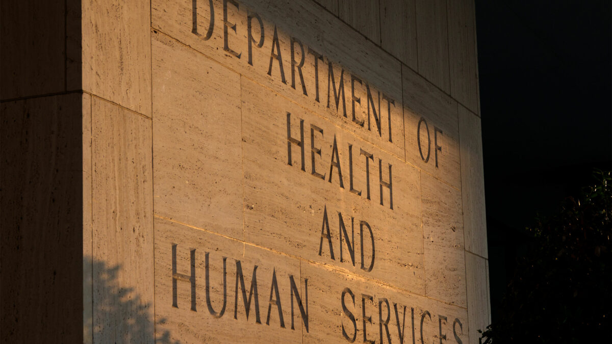 A sign is carved at the entrance to the Hubert H. Humphrey Building. It reads, "Department of Health and Human Services."