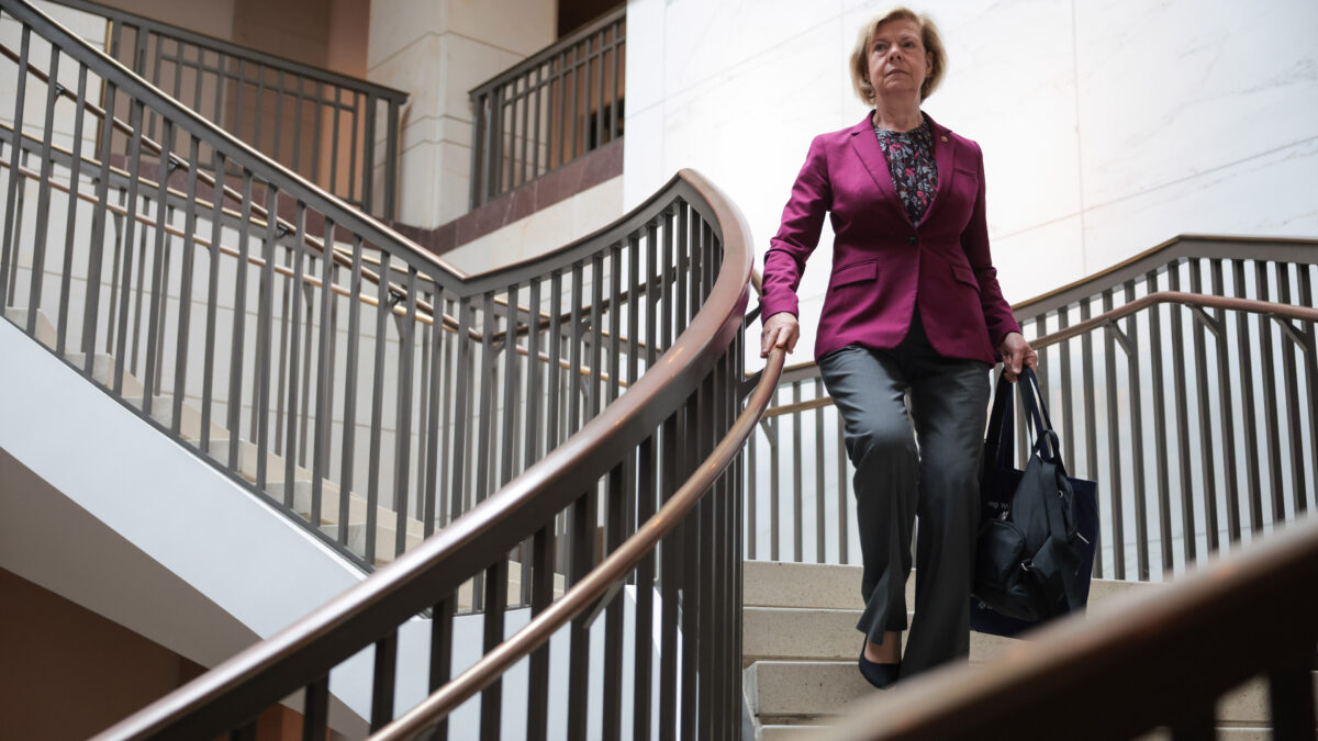 A photo of Sen. Tammy Baldwin descending a staircase.