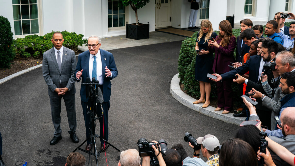 A photo of Hakeem Jeffries and Chuck Schumer holding a news conference.