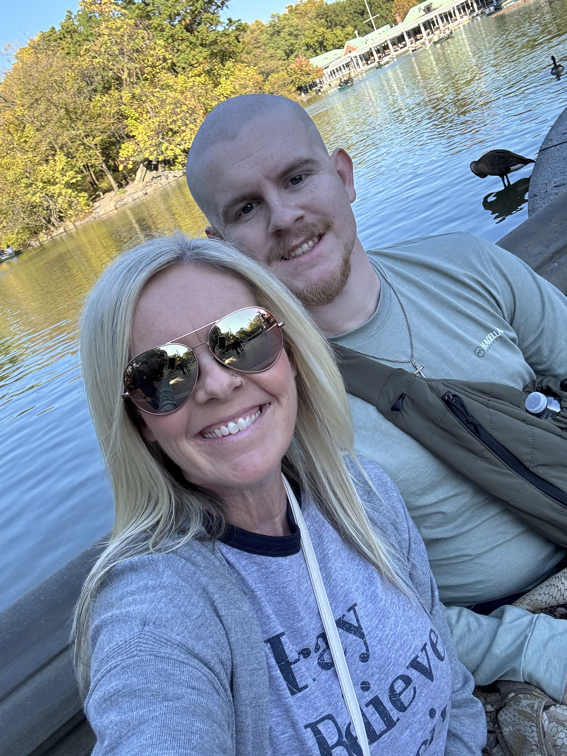 henderson_02-rotated-1 A photo of Tabitha Lowe and her son Mason Henderson smiling by a lake.