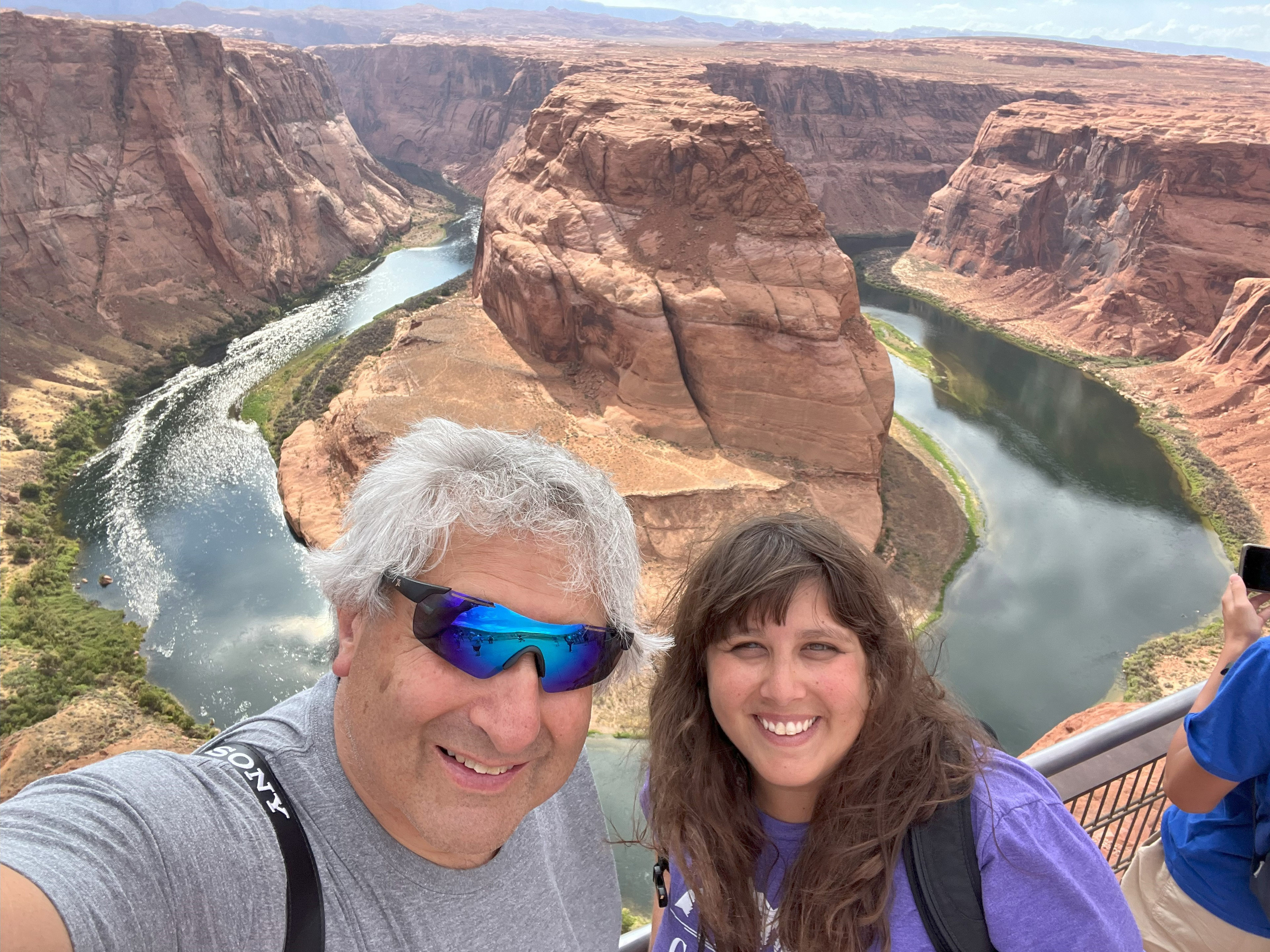 kahn_11 A photo of a father and daughter taking a selfie together at a canyon.