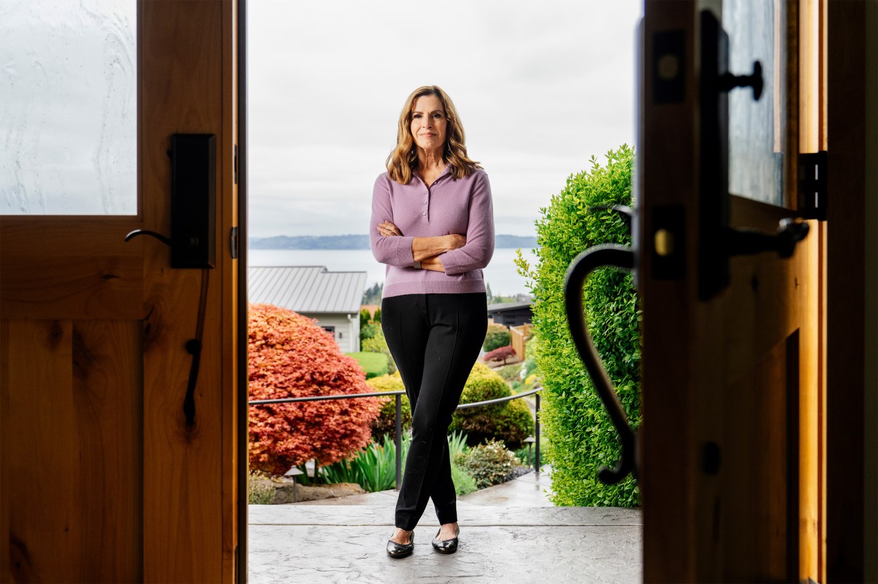 may_botm_-anderson_19 Jan Anderson stands on her porch, framed by doors on both sides.