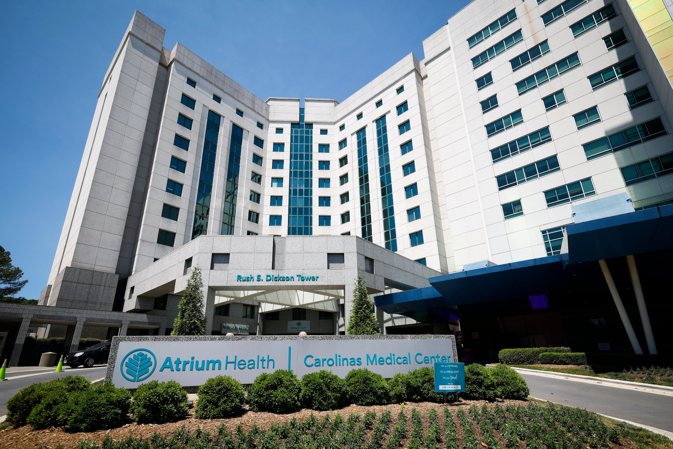 nc-med-debt-09-e28093-atrium An exterior photograph of the Carolinas Medical Center on a bright sunny day.