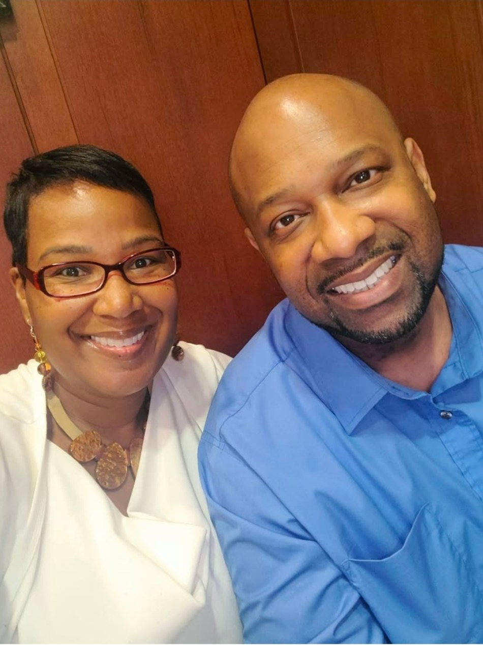 redtape A selfie of a husband and wife smiling together.