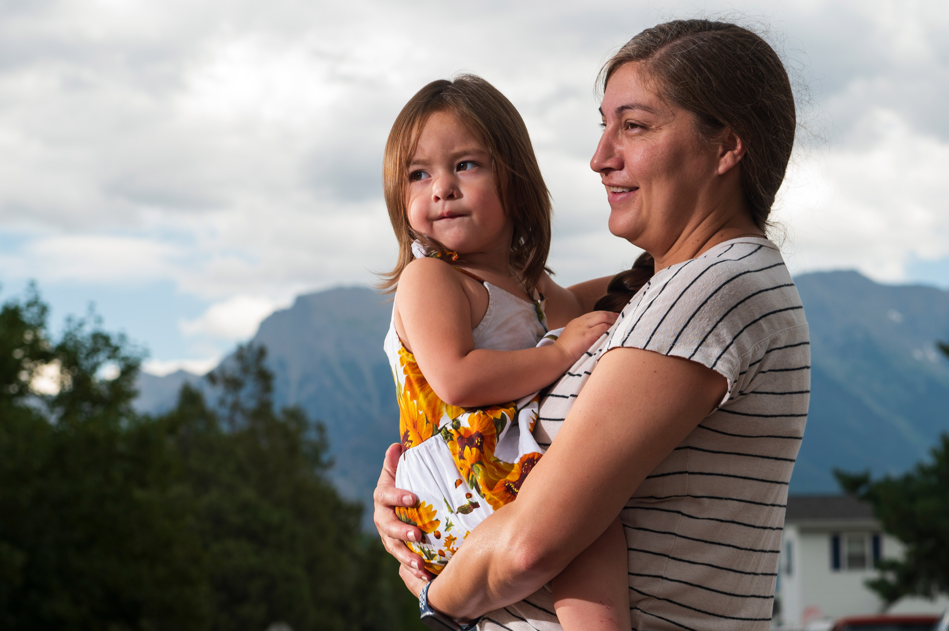 tribesmedicaid_03-resized A photo of Jonnell Wieder holding her daughter outside.