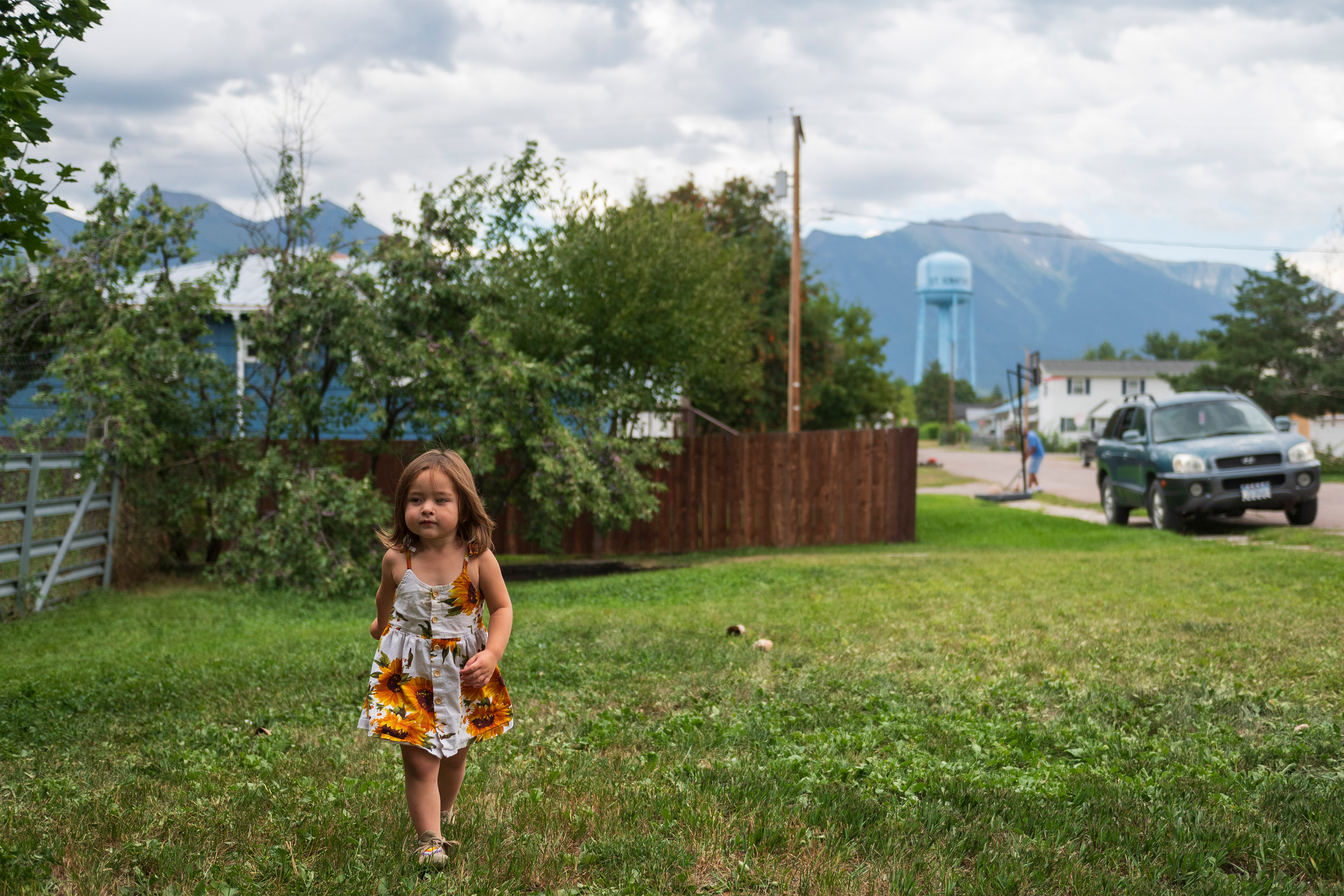 tribesmedicaid_08-resized A photo of young toddler walking in her front yard.