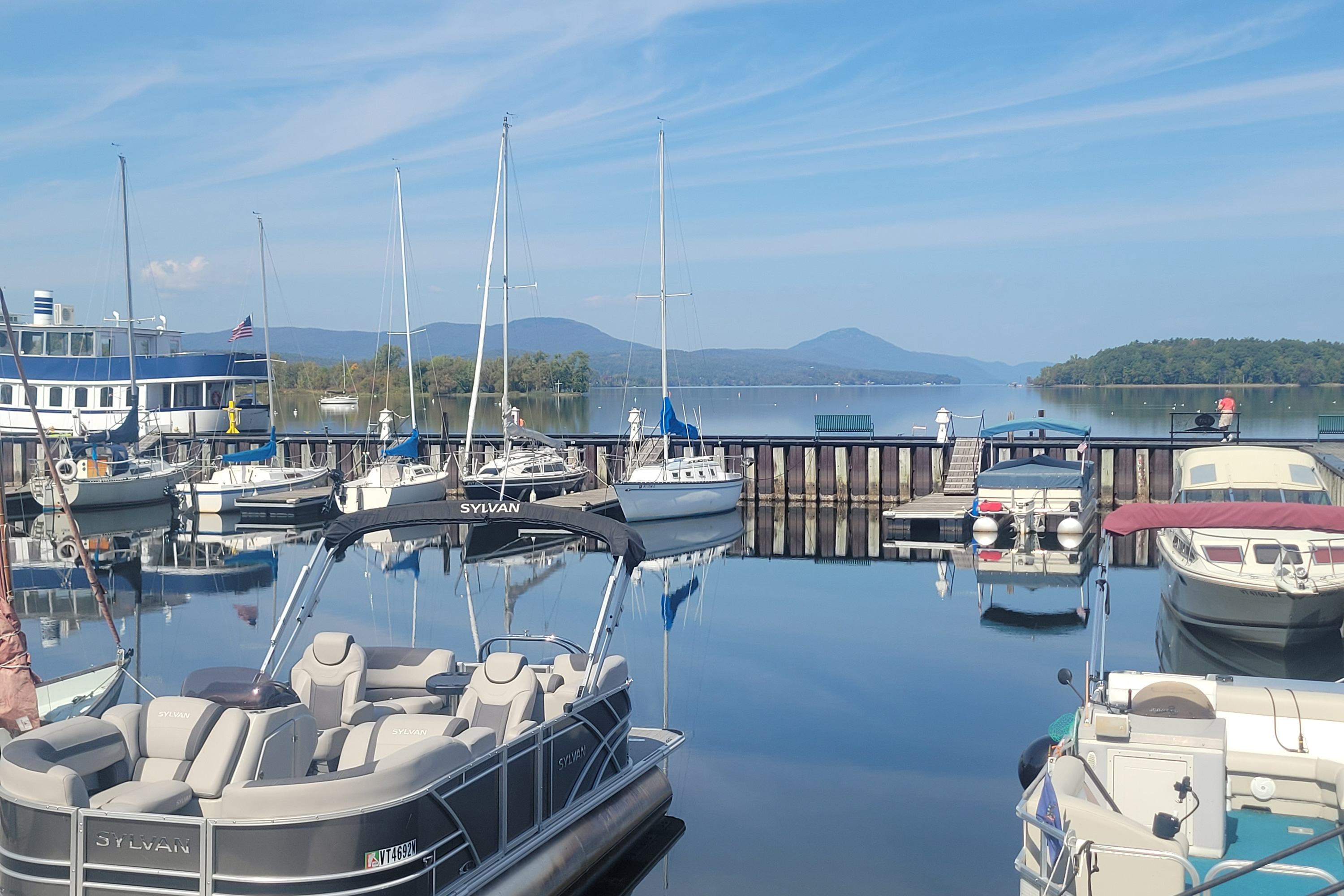vermont_04-resize A photo of a lake with boats docked on it.